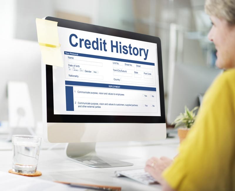 Women at computer regarding her credit history