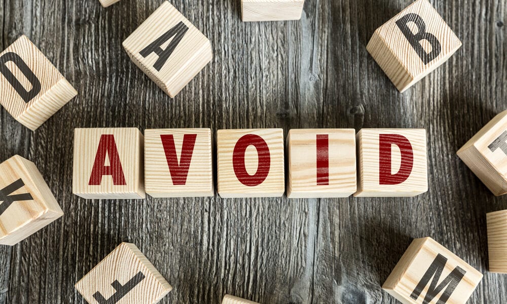 Word "Avoid" spelled out with building blocks in red