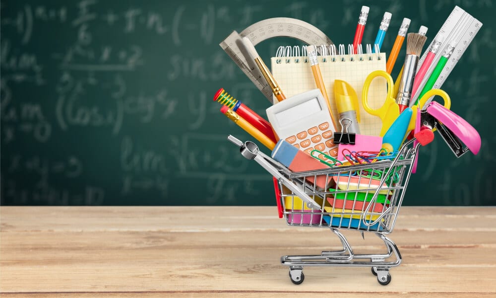 Mini shopping cart filled with school supplies