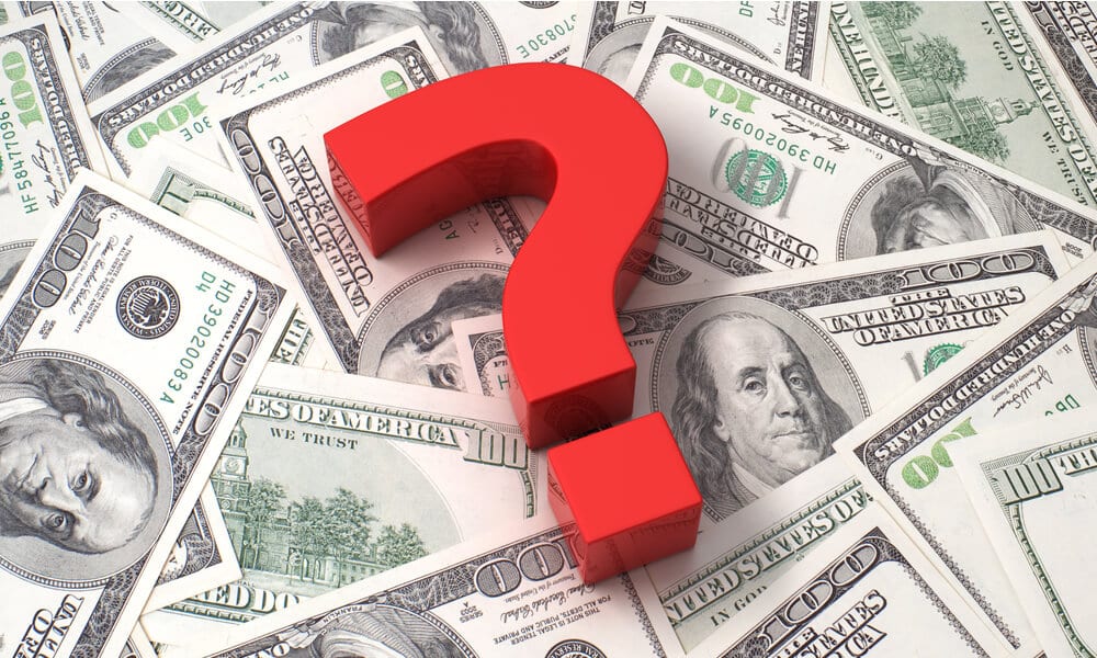 Red question mark on 100 dollar bill background