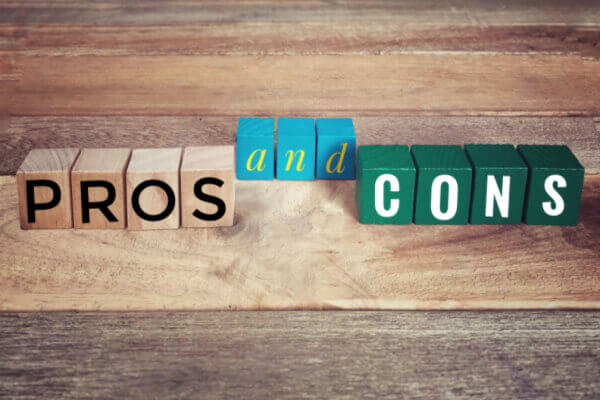 Pros and cons blocks on a wooden desk