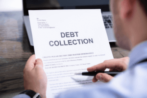 Man Reading Debt Collection Letter.